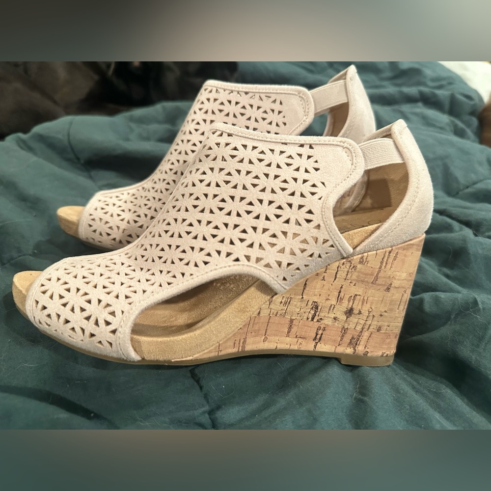 Comfortable wedges. Worn a couple times, but very very comfy.